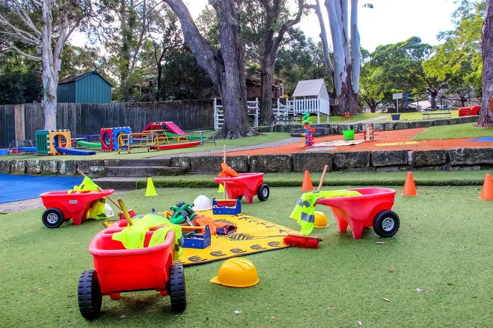 Outdoor playground with colourful play equipment and gum trees